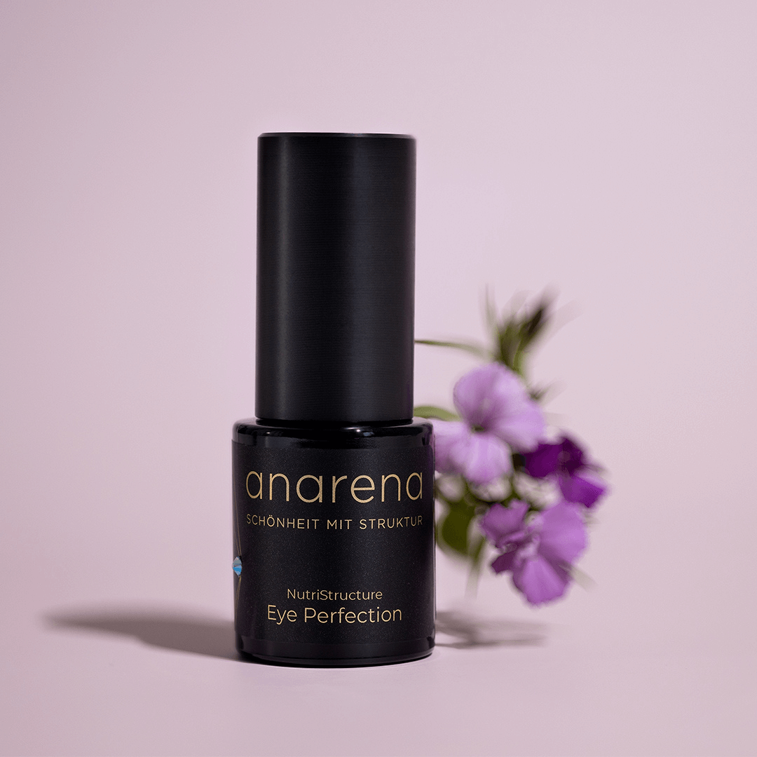 anarean NutriStructure Eye Perfection - Produkt mit Blumen in Hintergrund